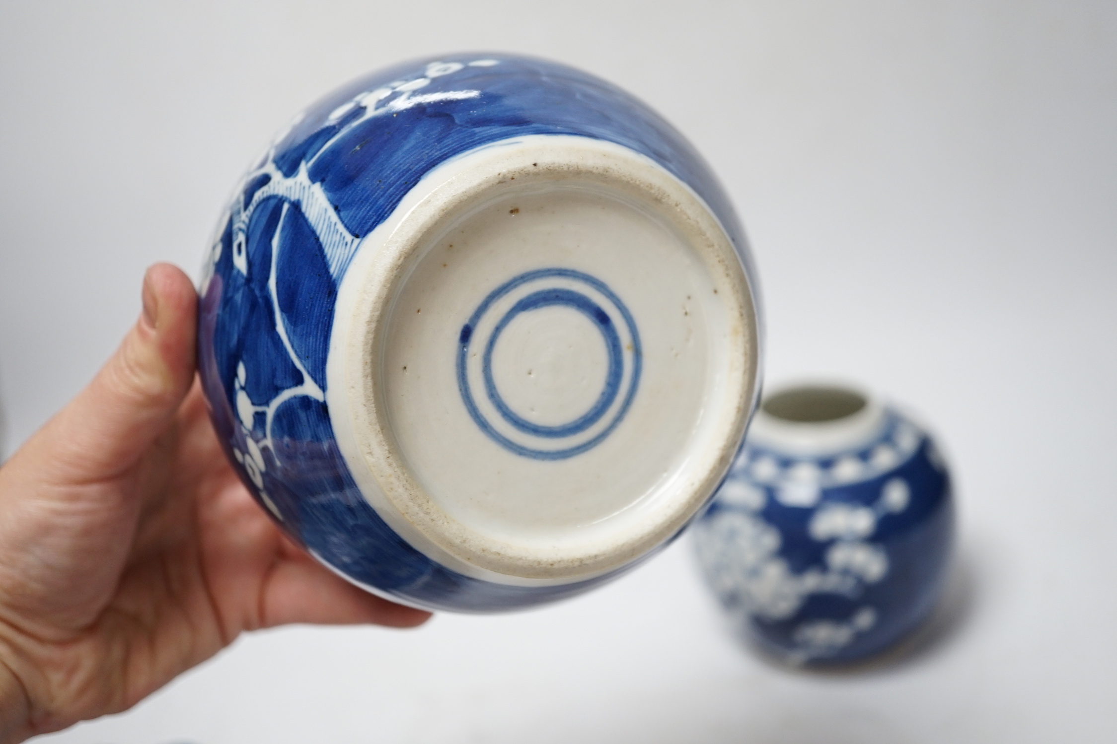 A collection of seven Chinese Prunus blossom jars, three with covers and two bowls